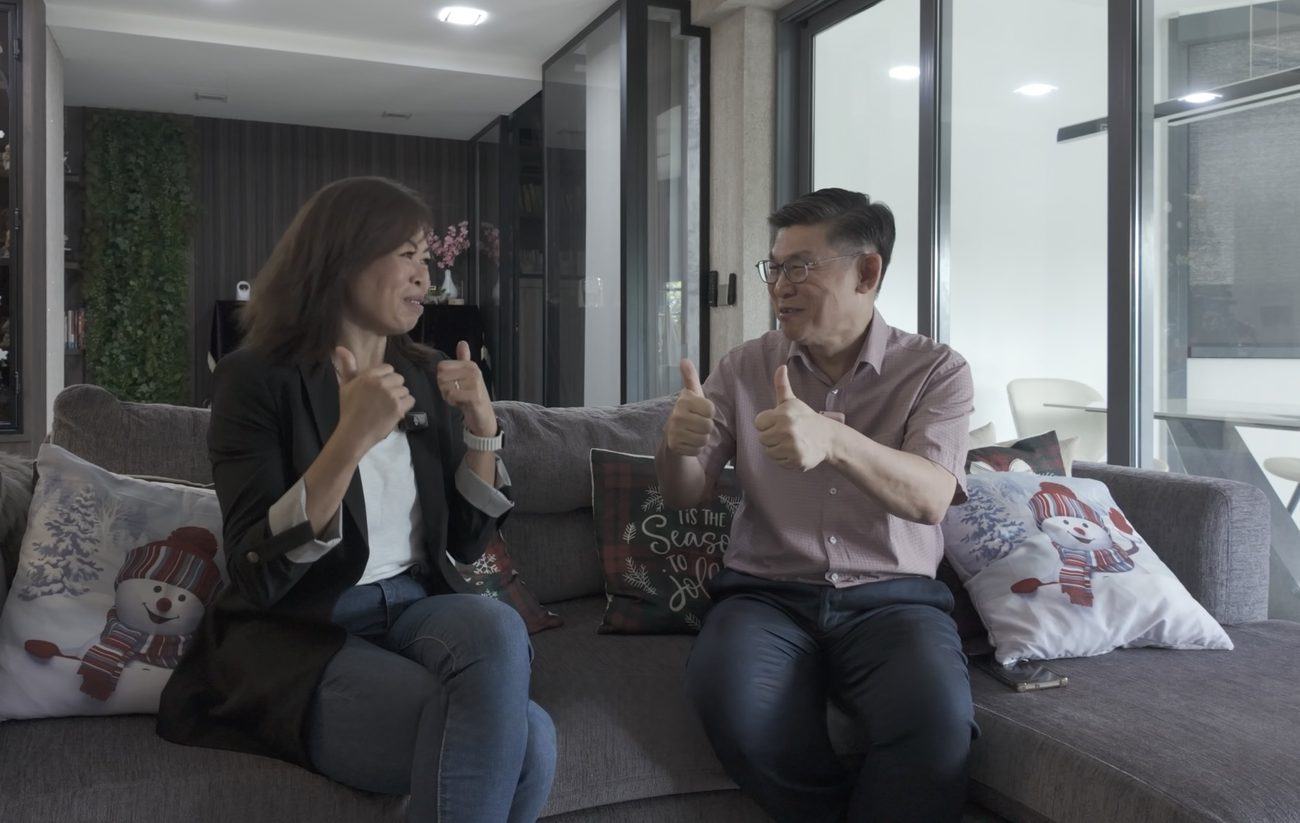 Esther Ng with clients in the landed home they have just purchased