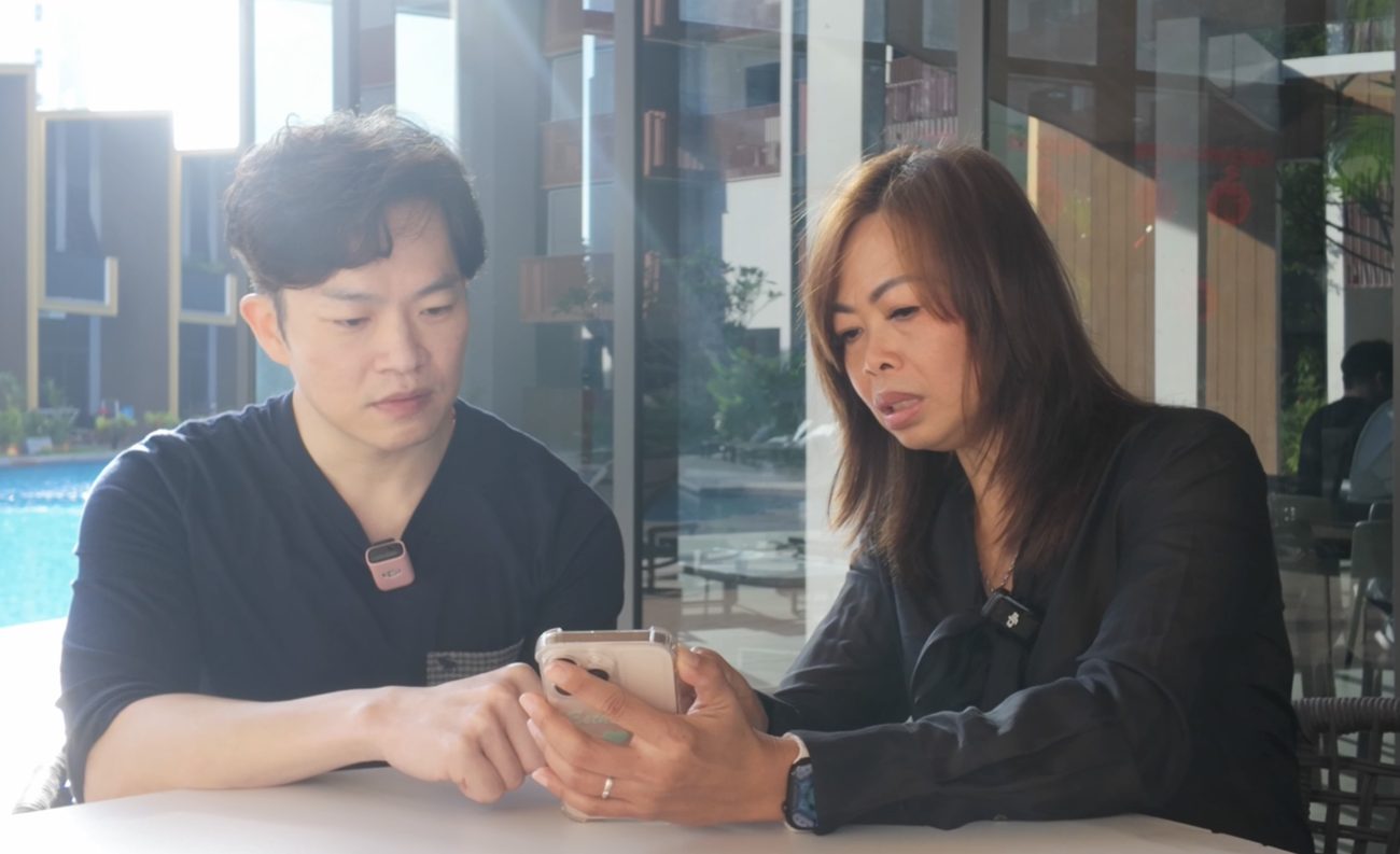 Esther Ng going through investment figures with a client